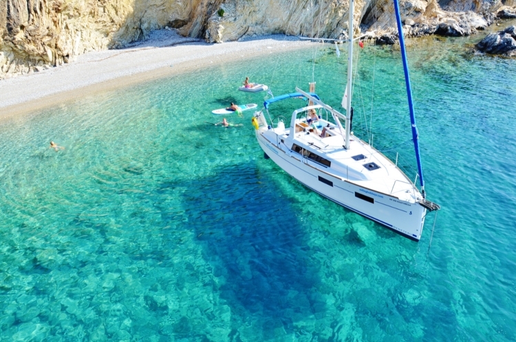 Yacht in crystal blue water of Greece